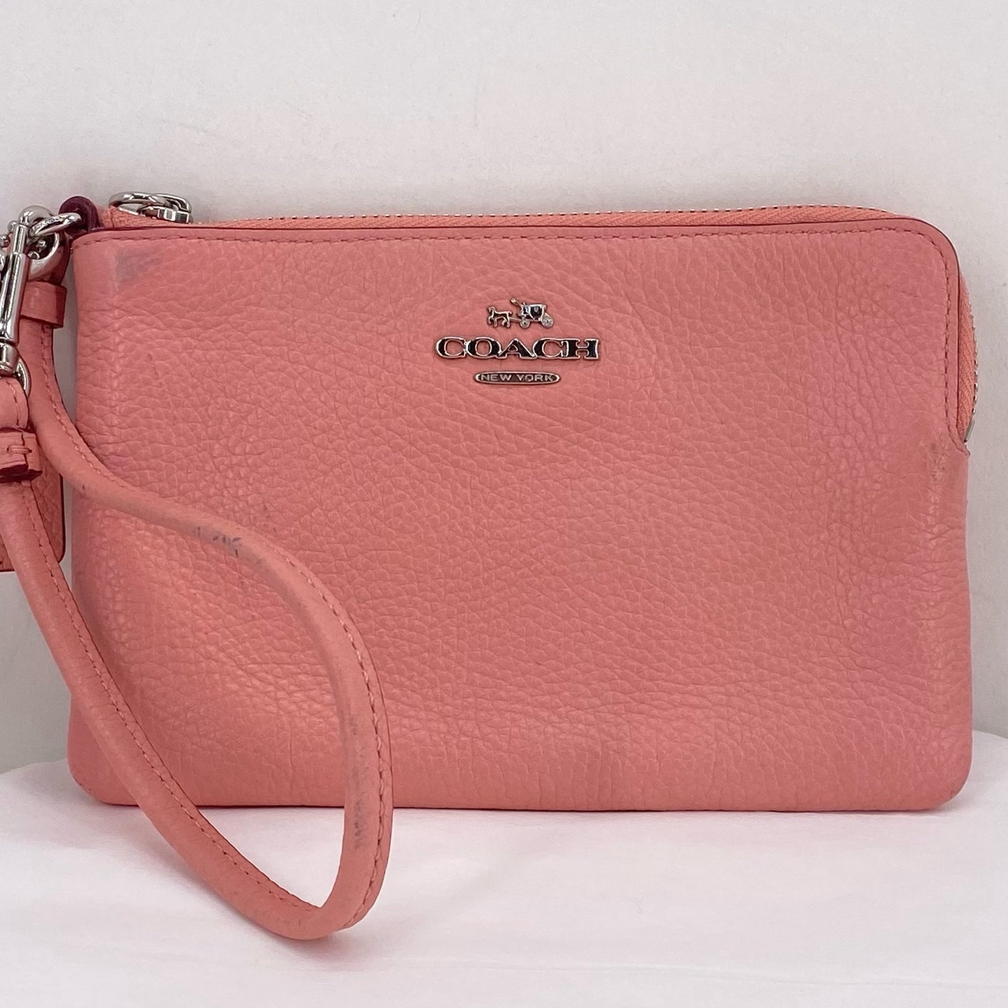 Peach COACH Leather Wristlet