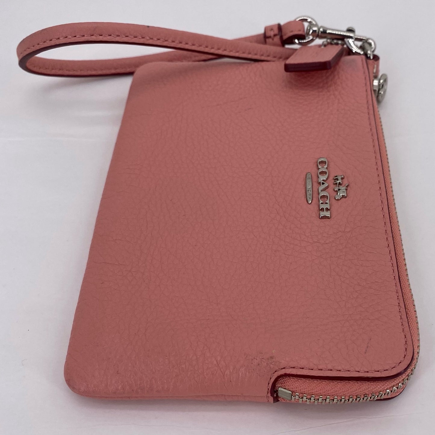 Peach COACH Leather Wristlet