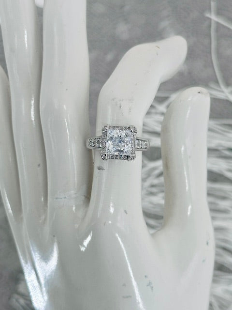 "Royale Saintess" Princess Cut Diamond Engagement Ring Set in Sterling Silver.